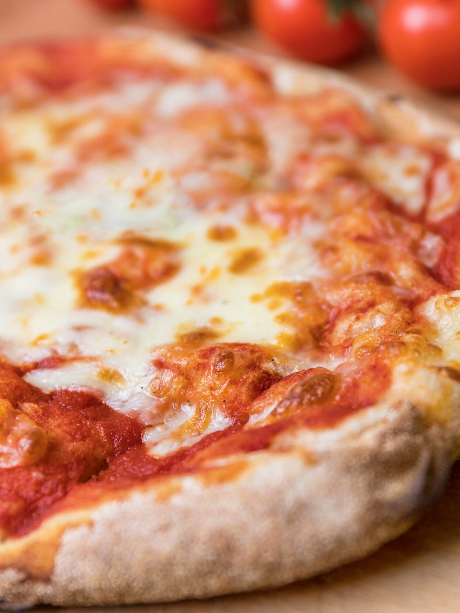 Italian Pizza Margherita Vertical closeup shot of an italian pizza margherita with tomato souce and mozzarella di bufala cheese